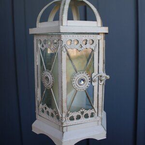 Sparkling, cream colored, heard accent lantern decor